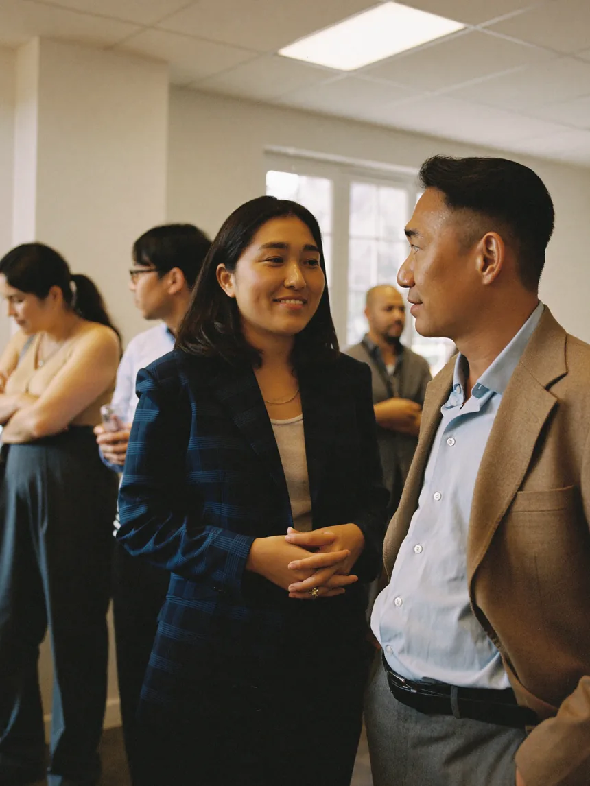 Two community members in conversation at an 802DNA networking event.