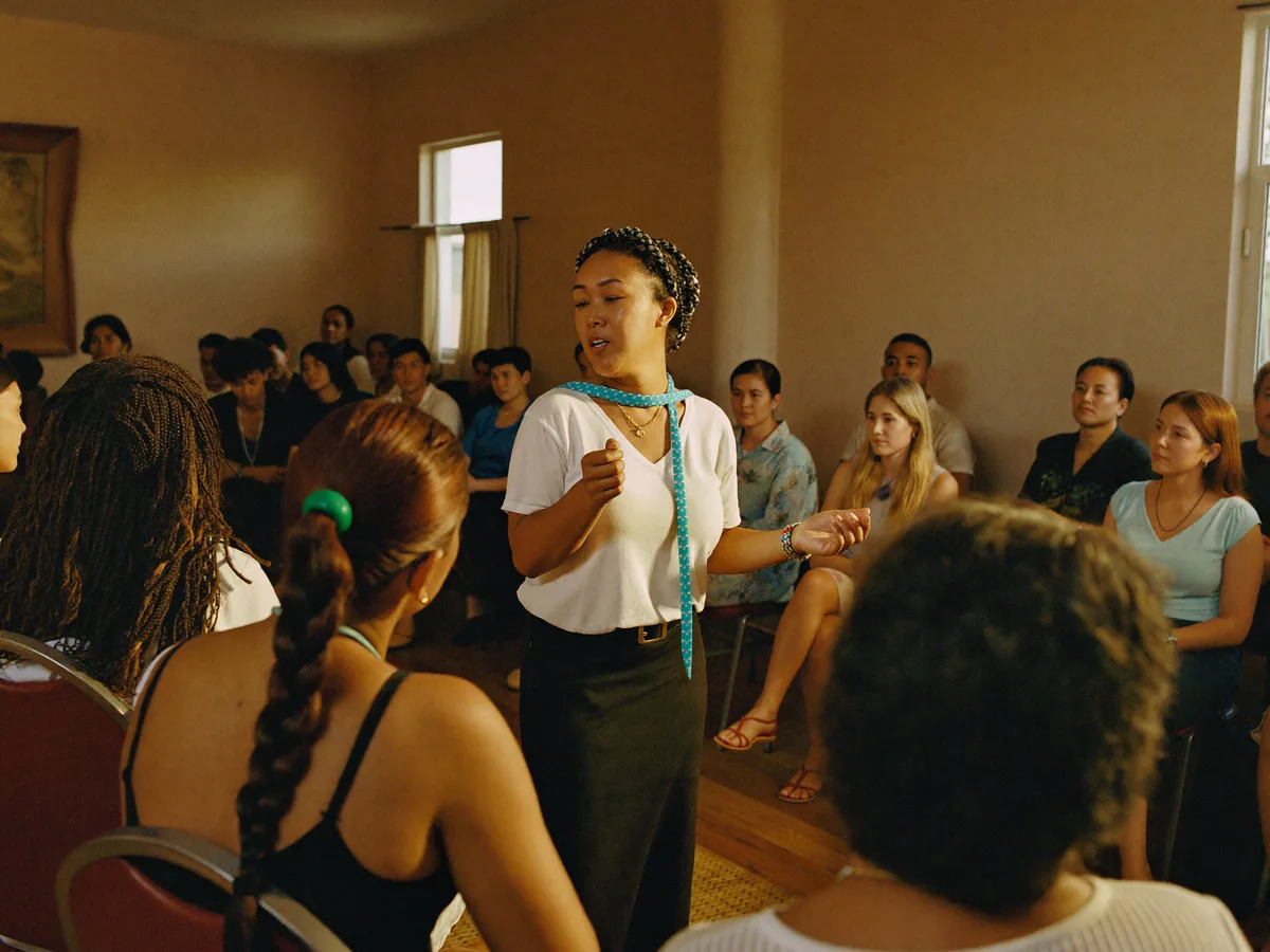 A speaker addressing an audience at a community leadership seminar.