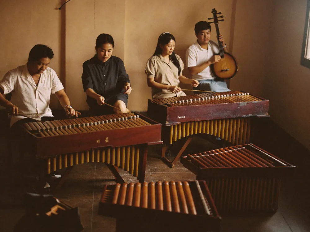 Khmer musicians rehearsing with traditional instruments.